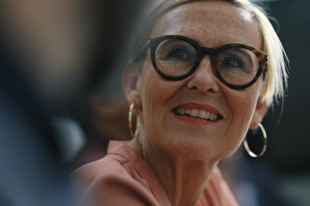 Woman looking at camera smiling | Pfizer clinical trials