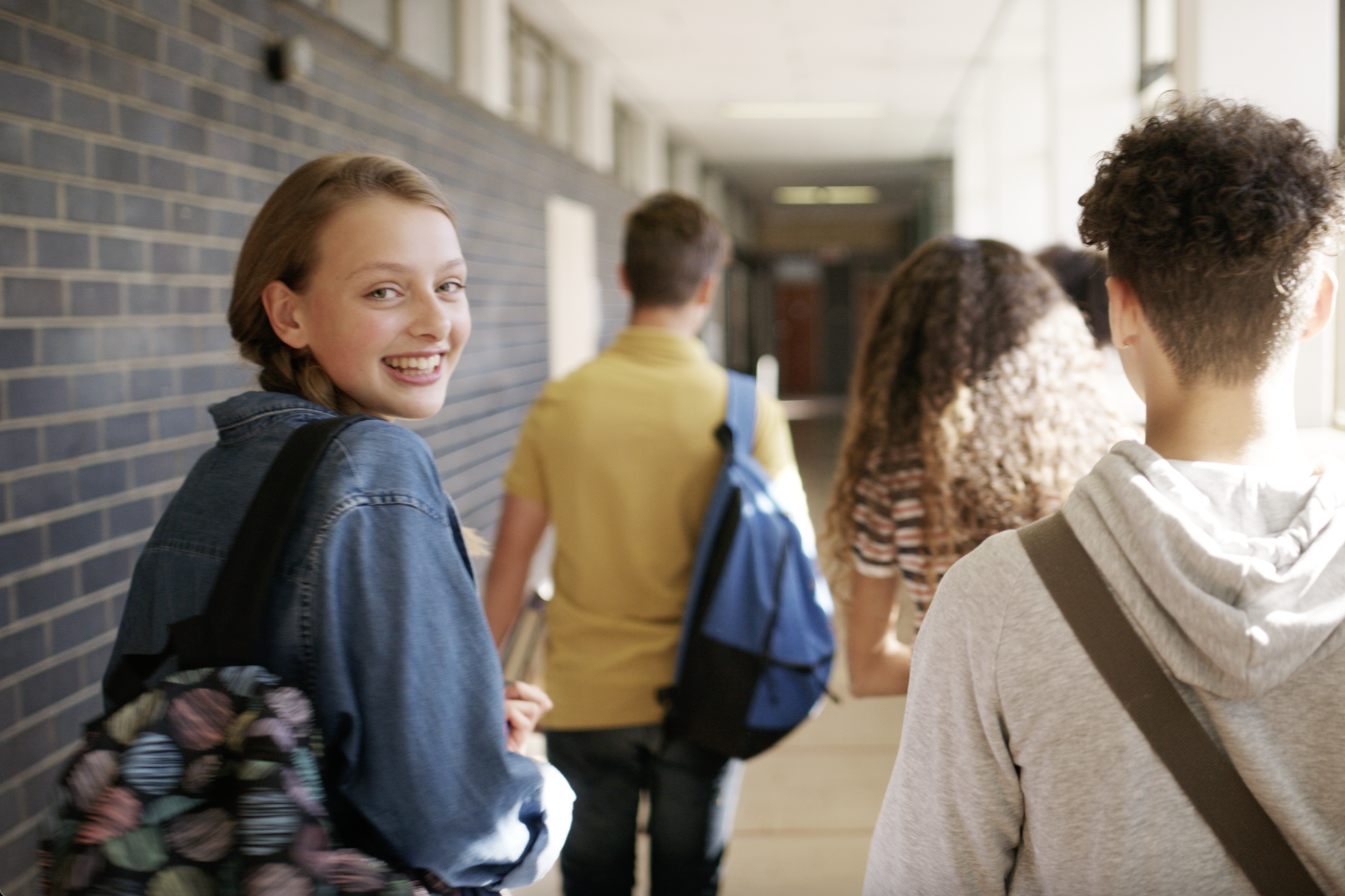 Smiling child in classroom | Pfizer clinical trials