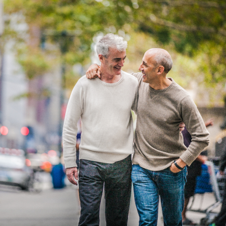 Happy couple walking outside | Pfizer clinical trials