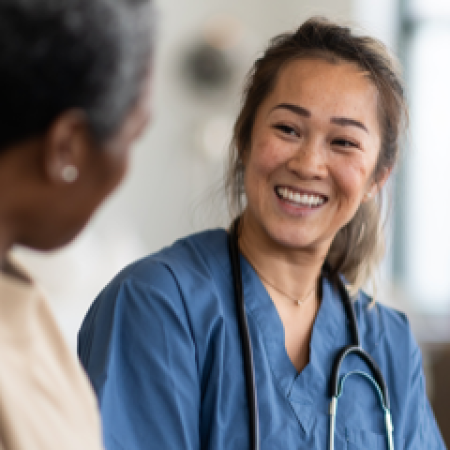 Patient and nurse in clinic | Pfizer clinical trials